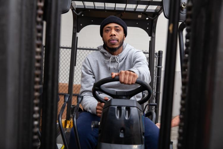 Student in a forklift